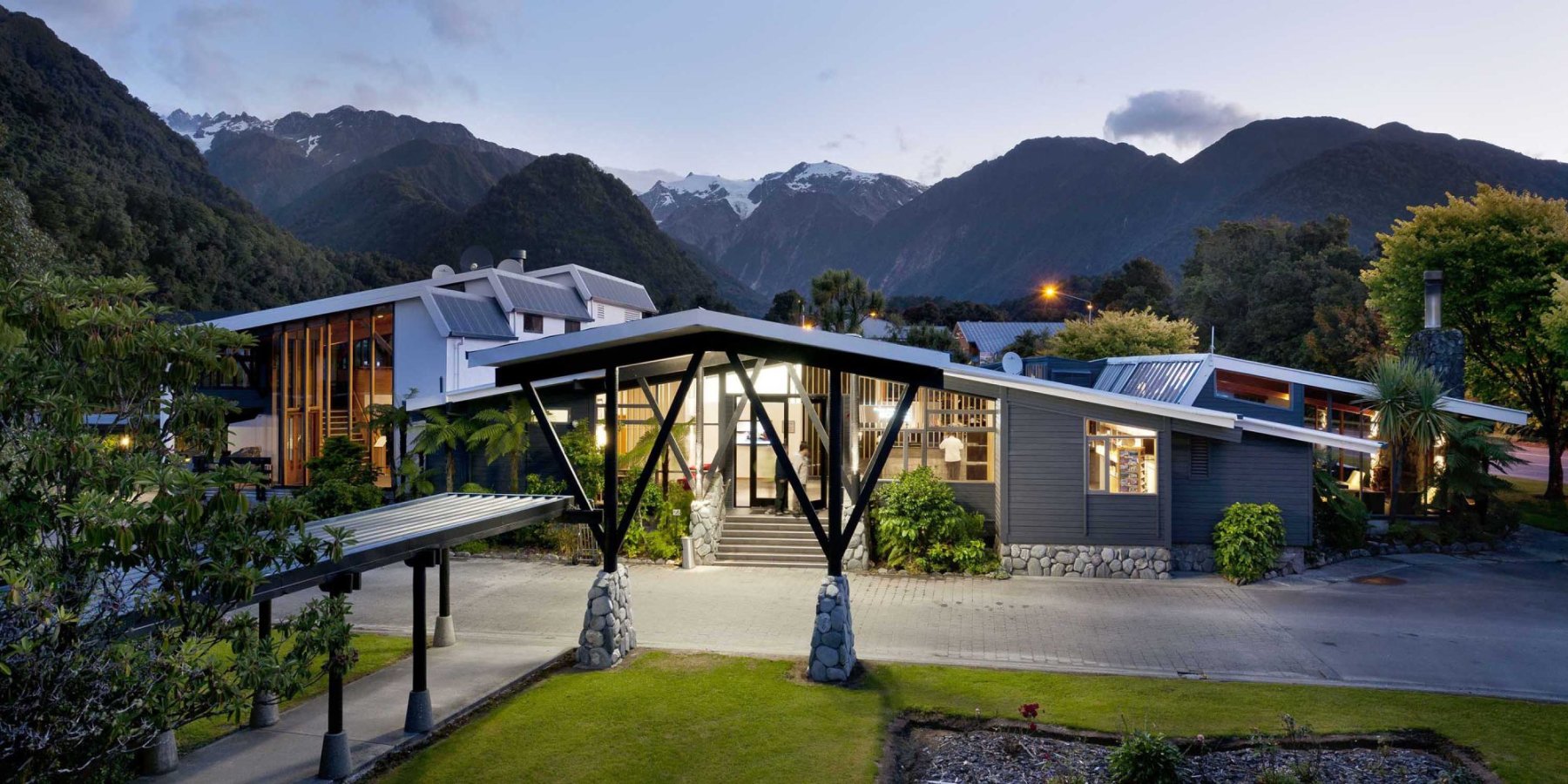Scenic Hotel Franz Josef Glacier Exterior Night View Banner 2000x1000